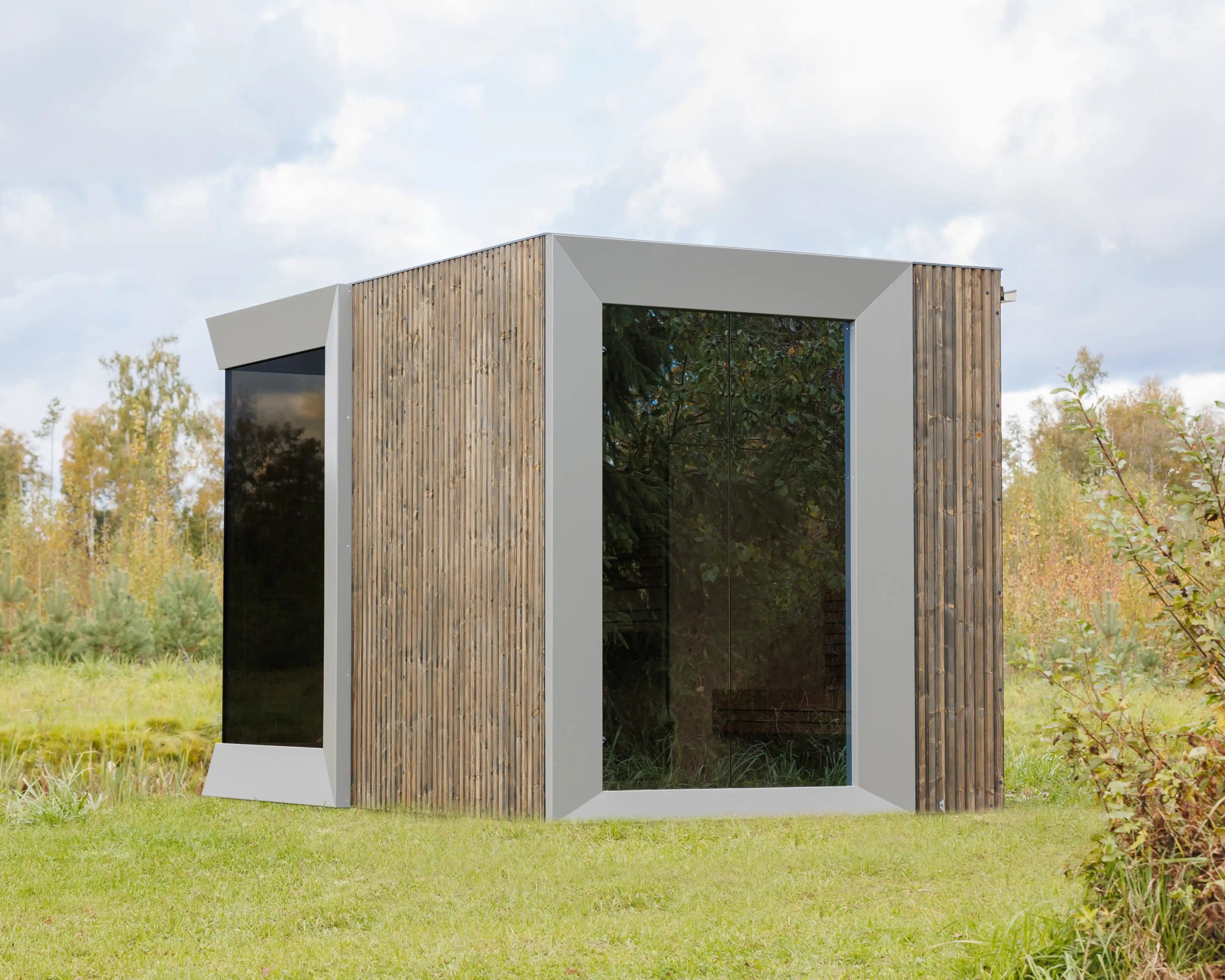 Modern outdoor cabin with wooden and glass facade in a natural setting